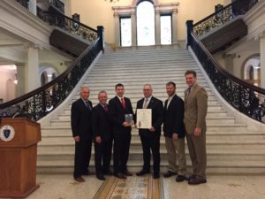 Tegra Medical's Franklin, MA management team receiving this award at the state house in Boston, including General Manager, Bob Miller.