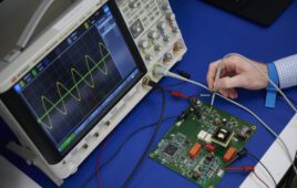 A Minnetronix engineer evaluates a control board for an electroporation system.