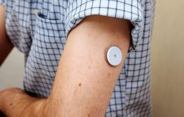 3M provided Shutterstock stock art with a wearable medical device or sensor stuck to a man's arm as part of their announcement of a new medical adhesive that sticks for up to 28 days