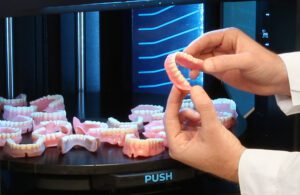 Stratasys marketing image showing 3D-printed dentures printed with the new TrueDent resin