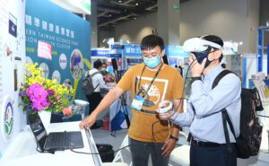 Medical Taiwan marketing image of attendees trying out virtual reality headset digital health at their medtech B2B event