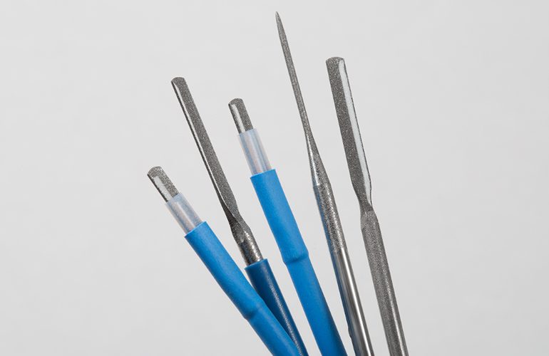 Dip-coated surgical blades.