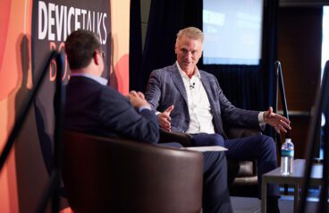 Photo of DeviceTalks Editorial Director Tom Salemi (left) interviewing Boston Scientific CEO Mike Mahoney (right) in front of a crowd of medtech insiders at our DeviceTalks Boston show in early May.