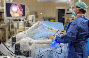 A surgeon using the Moon Surgical Maestro surgical robotics system.