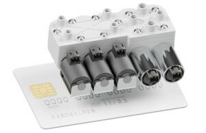 A Portable Oxygen Concentrator Manifold Solution with a credit card for scale.